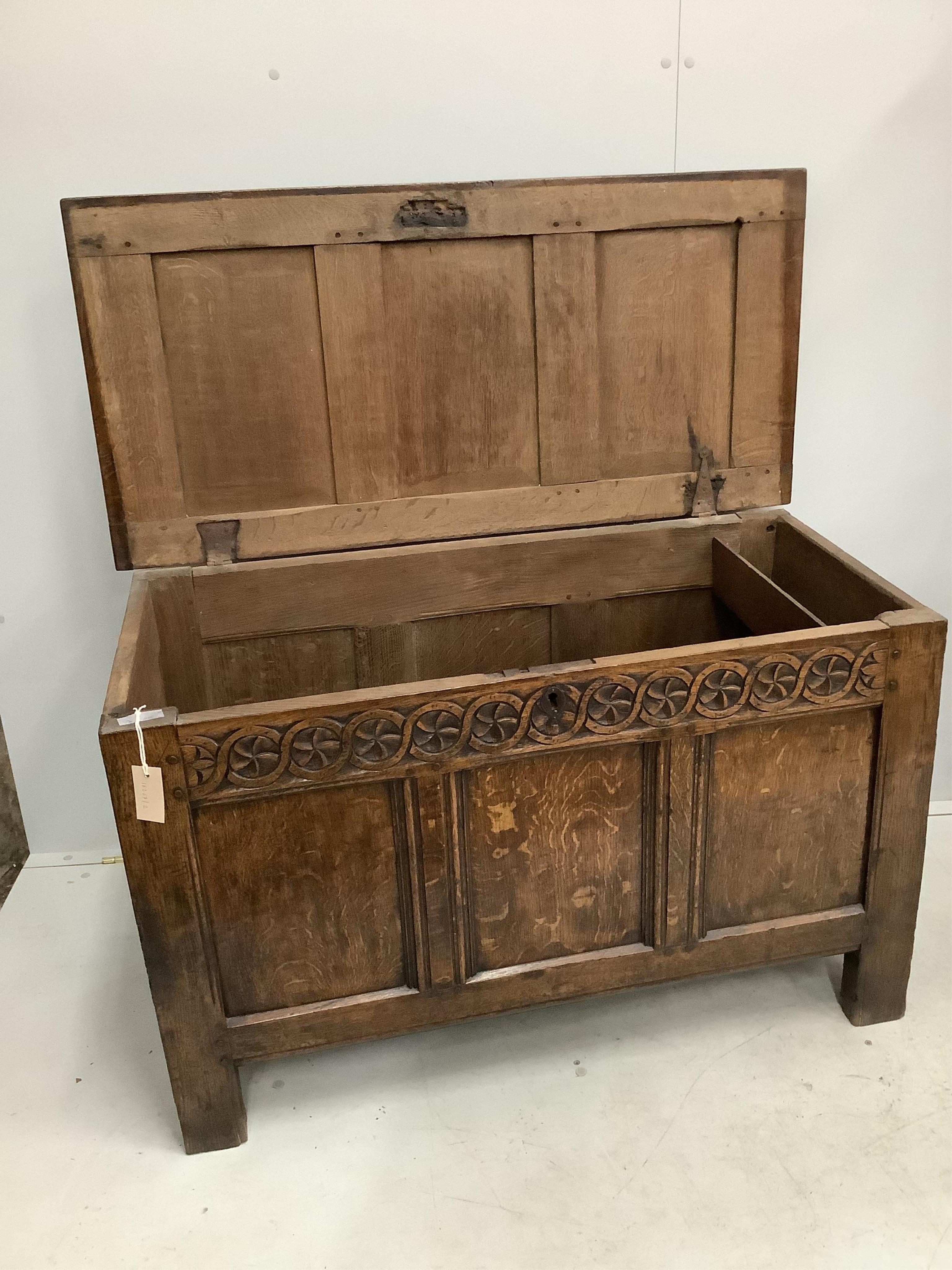 A 17th century oak coffer, width 112cm, height 68cm. Condition - fair to good